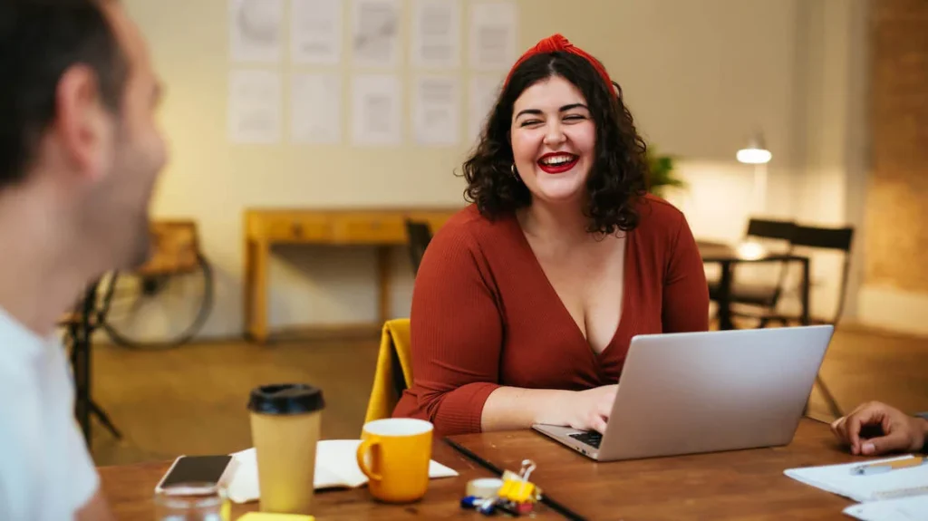 benefits-of-feedback-woman-at-work-laughing